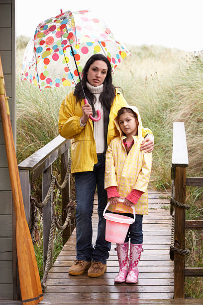 istock Mother and daughter with umbrella 177400166