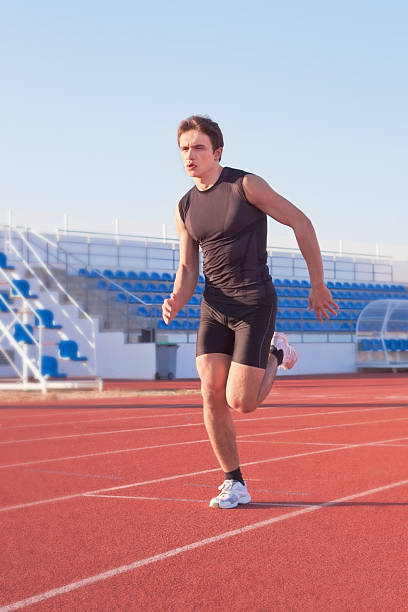 istock Young man starts running in the stadium. Treadmill. 177400301