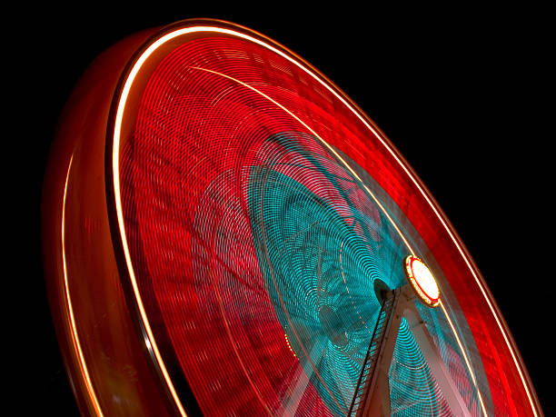 istock Red and blue Ferris wheel blurred at night 177400334