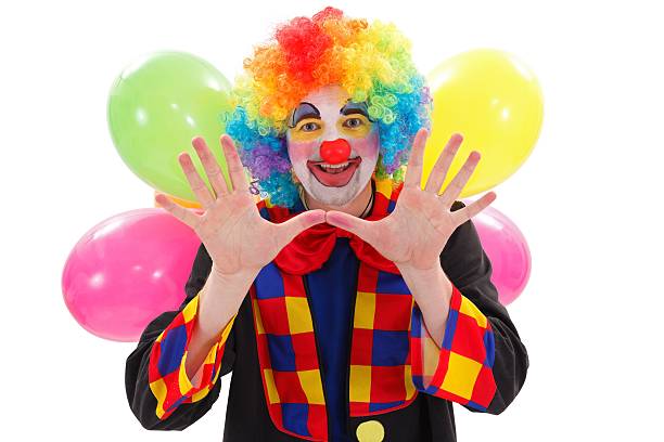 istock Happy clown with balloons, gesturing 177400585