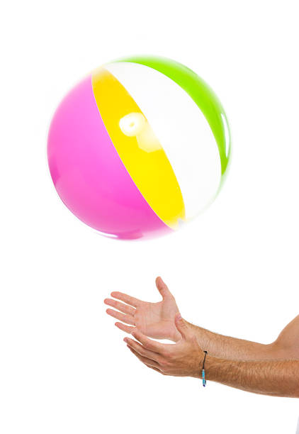 istock Closeup on males hand throwing beach ball up 177400959