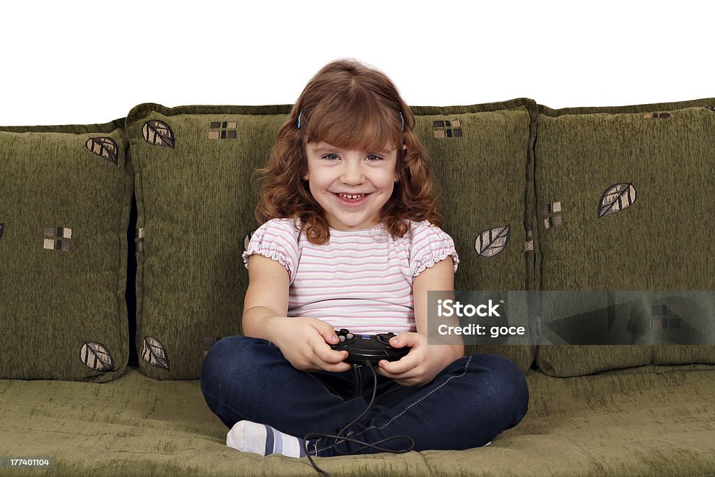 Niña juegue videojuegos - Foto de stock de Actividad libre de derechos