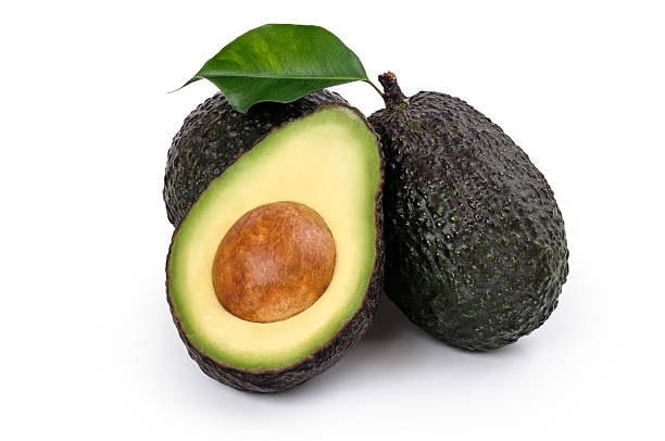 спелый ав�окадо органических - avocado portion fruit isolated стоковые фото и изображения