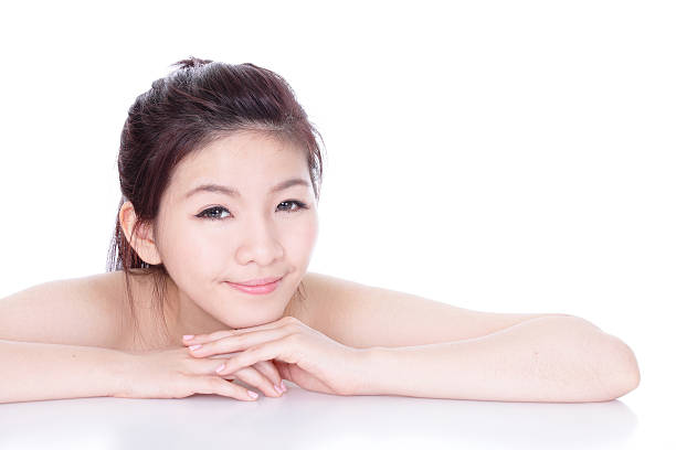 若いアジアの少女の笑顔の顔のクローズアップ - asian spa treatment ストックフォトと画像