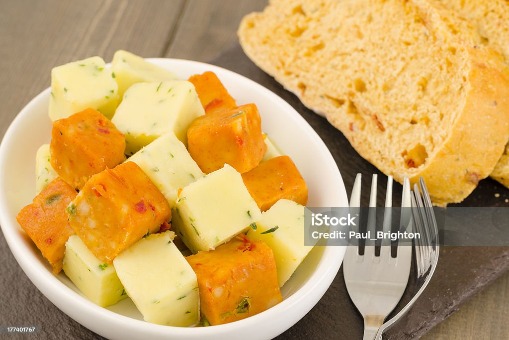 Cold Tapas - Spanish Chilli &amp; Herb Cheese Cubes Spanish style cheese cubes with herbs served with mediterranean bread. Manchego Stock Photo