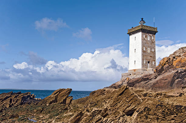 istock Lighthouse by the coast in Britain with clouds 177402405
