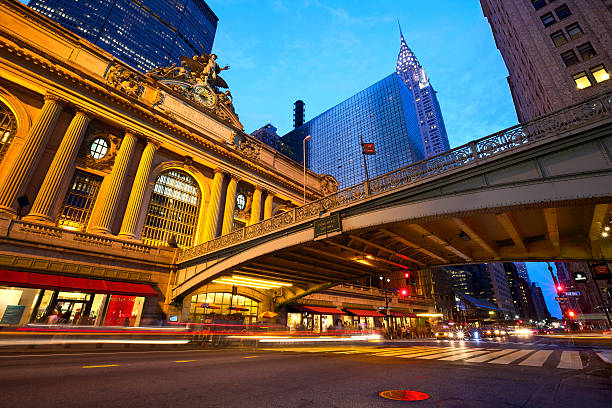 Ground view image of Grand Central Terminal "Grand Central along 42nd Street at dusk, New York City" 42nd street stock pictures, royalty-free photos & images