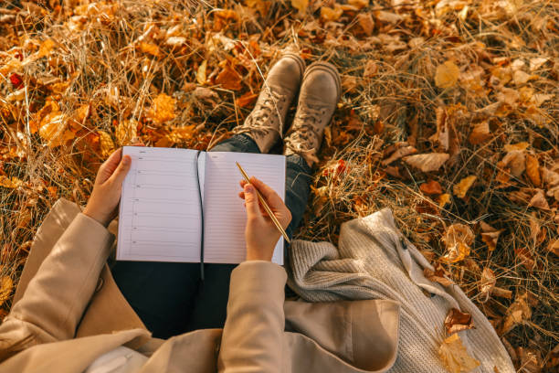 istock Girl with paper planner outdoors, autumn concept 1774027955