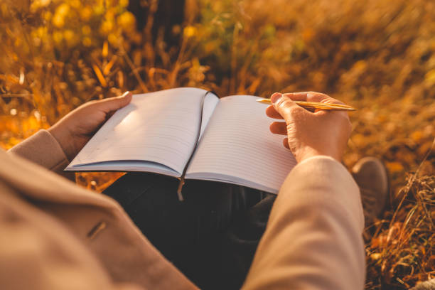 istock Girl with paper planner outdoors, autumn concept 1774027956