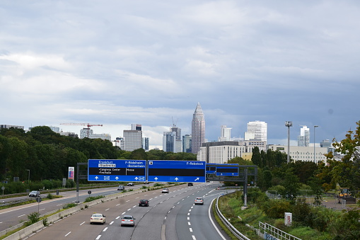 Frankfurt, Germany - 09/23/2023: Autobahn into Frankfurt am Main with the skyline and gray sky