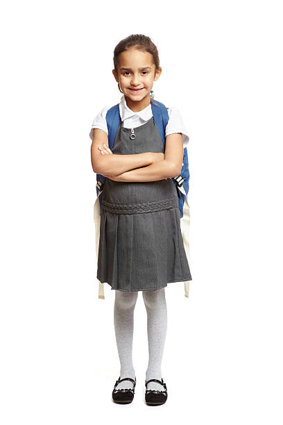 istock 8 year old school girl with backpack smiling 177403013