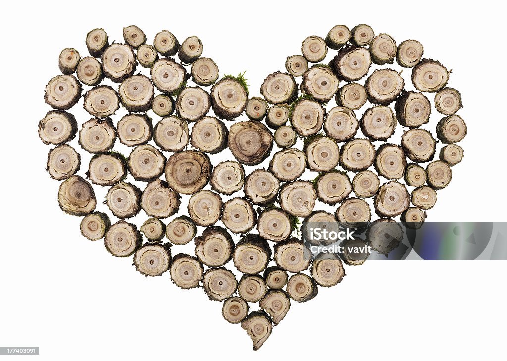 Wooden heart concept isolated Wooden forest heart concept made from cross-sections of a trees trunk isolated on white Abstract Stock Photo