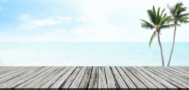 istock Table on Beach Blue Sea Cloud Sky Horizon Background, Wood Desk Palm Tree Summer Tropical Mockup Top Display Product Beauty Cosmetic, Template Scene Island Ocean Coast Nature Water Stage Landscape. 1774031271