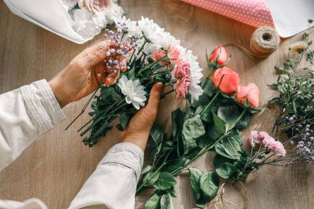 istock Florist at work. Woman making autumn floral decorations 1774033461