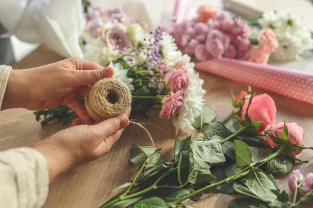 istock Florist at work. Woman making autumn floral decorations 1774033464