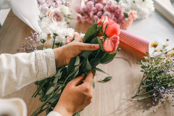 istock Florist at work. Woman making autumn floral decorations 1774033466