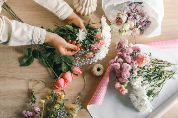 istock Florist at work. Woman making autumn floral decorations 1774033468