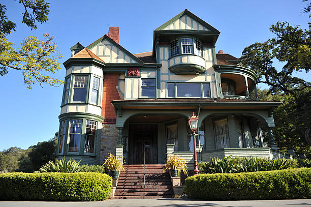 Fredericton, Canada - July 2016: A fine art museum in the pink house and a beautiful black and red Victorian home, located in the Fredericton, the capital city of New Brunswick, known for it's historic district.