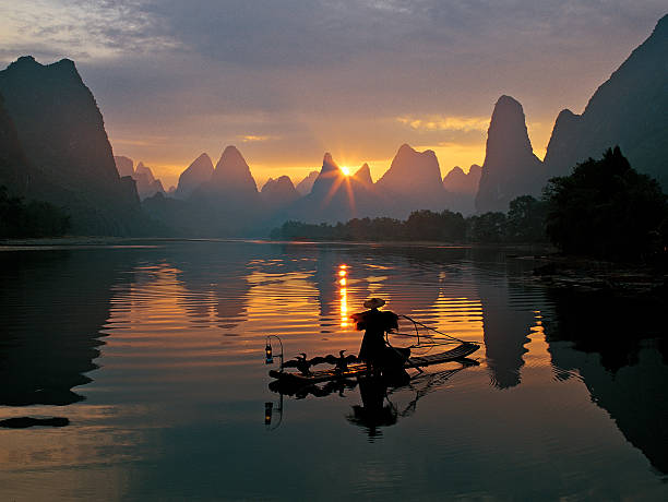 istock Fishermen and osprey in Li River 177403672
