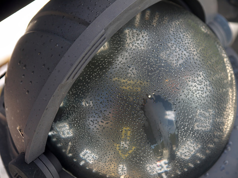 Marine Gyro compass in drops of mist close-up, sailing Yacht navigation equipment