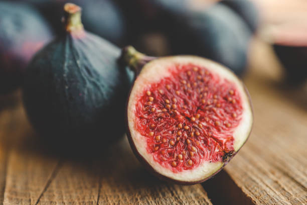 istock A few figs in a bowl on an old wooden background. 1774039566