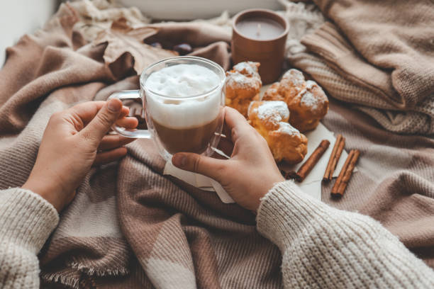 istock Cup of coffee in hands, cozy autumn 1774041295