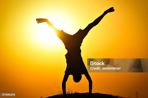 Man In The Sunset Jump And Shout Stock Photo - Download Image Now - Activity, Adult, Back Lit