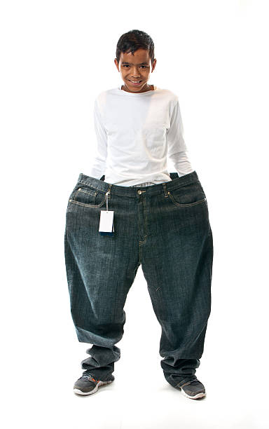 Way Too Big Pants Stock Photo - Download Image Now - Jeans, Trying On,  Beauty - iStock