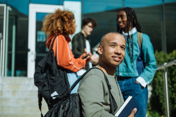 istock Large group of diverse students in campus outdoors, after finished lectures at college of business 1774056043