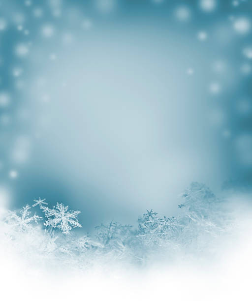 A blue and white snowflake background stock photo