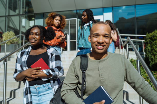 istock Large group of diverse students in campus outdoors, after finished lectures at college of business 1774058866