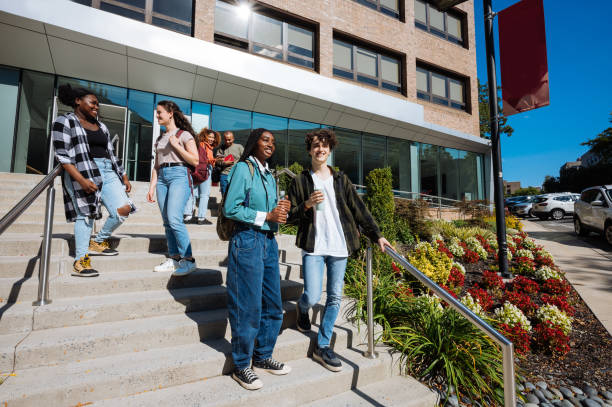 istock Large group of diverse students in campus outdoors, after finished lectures at college of business 1774059222