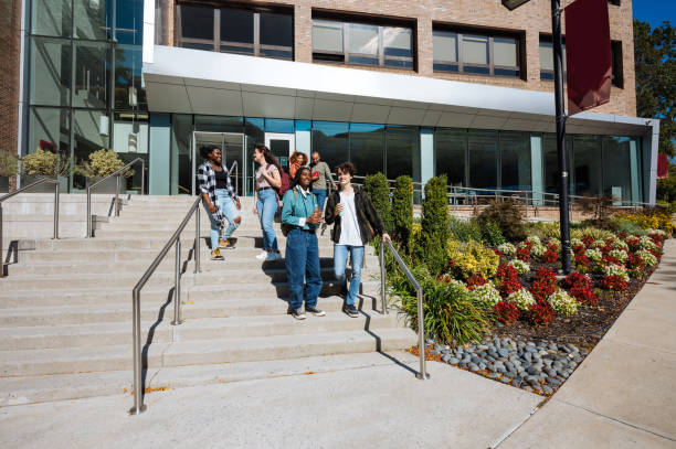 istock Large group of diverse students in campus outdoors, after finished lectures at college of business 1774059439