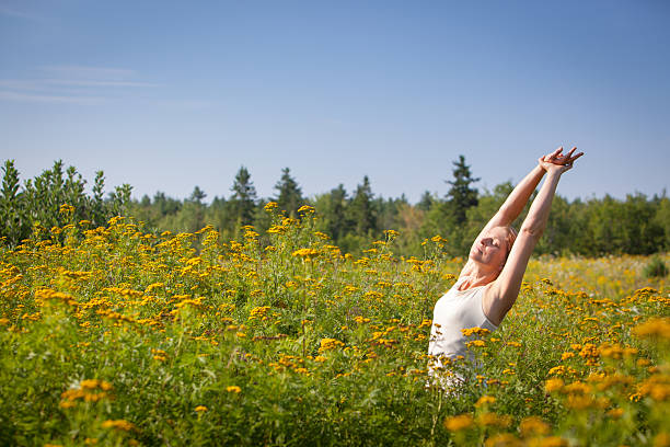 istock woman stretching in ragweed flowers 177406195