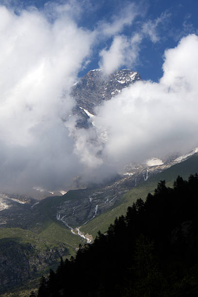 Alagna, mountain and clouds view A view of mountains with clouds from Alagna in Valsesia (vertical format) roberto alagna stock pictures, royalty-free photos & images