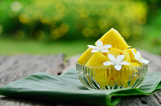 Pineapple with jasmine flower stock photo