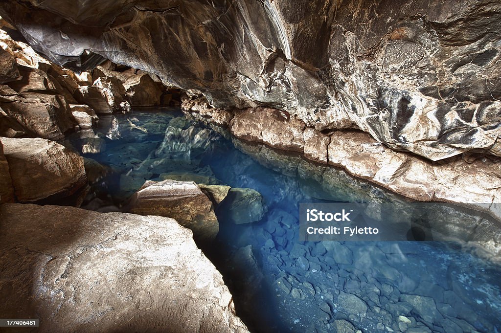 Grjotagja Volcanic cave Grjotagja with a incredibly blue and hot thermal water near lake Myvatn in the northeastern Iceland Beauty In Nature Stock Photo