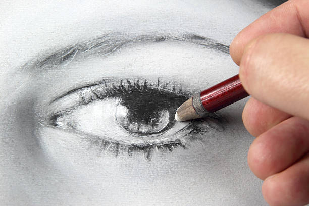 Drawing a portrait - eye close up stock photo