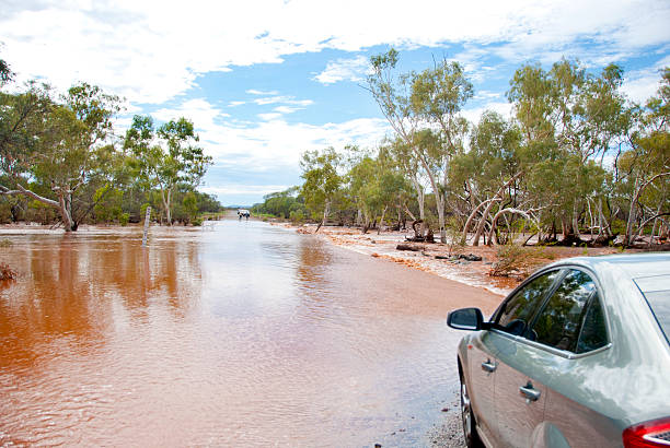 Traffic waiting at flooded road