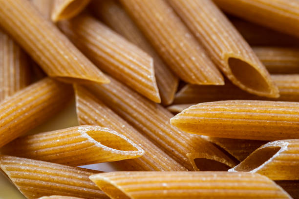 Close up of a pile of uncooked whole wheat pasta