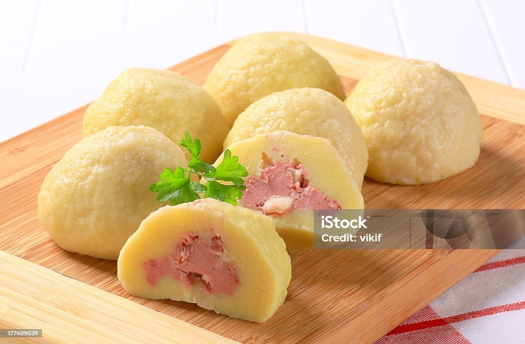 Meat stuffed potato dumplings Meat stuffed potato dumplings on cutting board Baloney Stock Photo