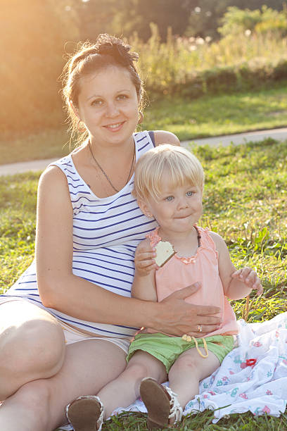 istock daughter and her mother rest in the park 177409329