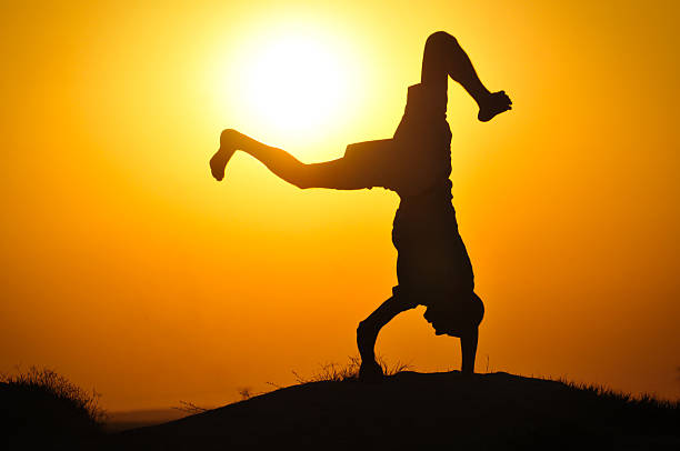 istock Man in the sunset jump and shout 177409660