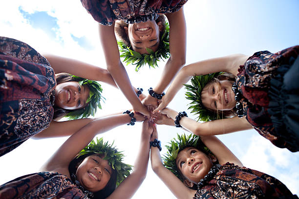 Hula Girls Smiling Low angle view of Dancers coming together United as a team and friends hula dancing stock pictures, royalty-free photos & images
