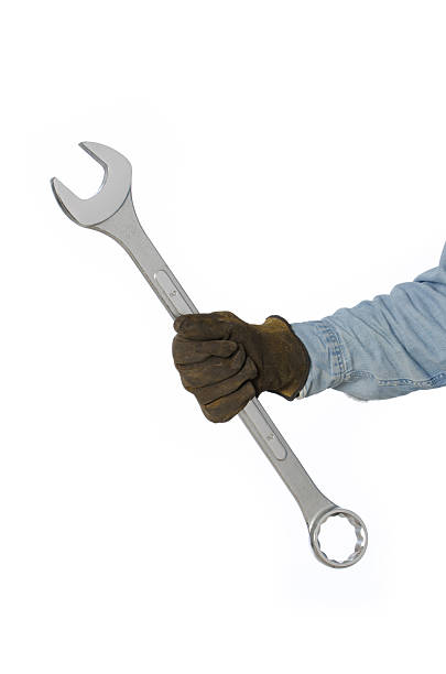 istock Man's gloved hand Holding Over Sized Chrome Wrench-isolated on white 177410172