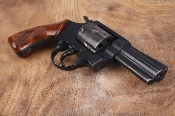 istock Revolver on wooden table 1774110180