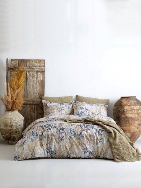 istock Wooden framed comfortable bed with many pillows, blanket 1774110520