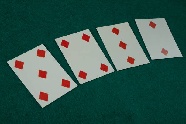 istock Old west era playing card on gambling table. 5,4,3,2 of diamonds. 1774110523