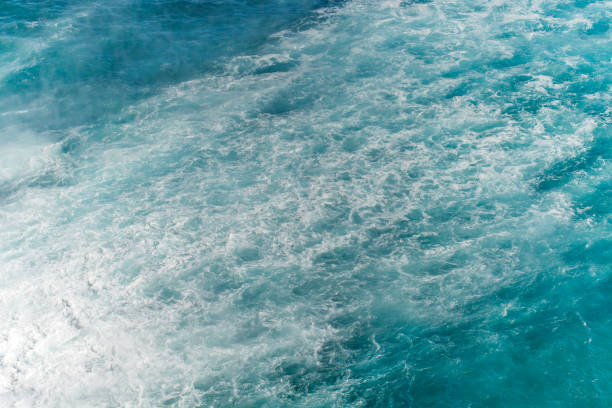 istock Foam white and waves trace from falling water from waterfall in sea 1774110637
