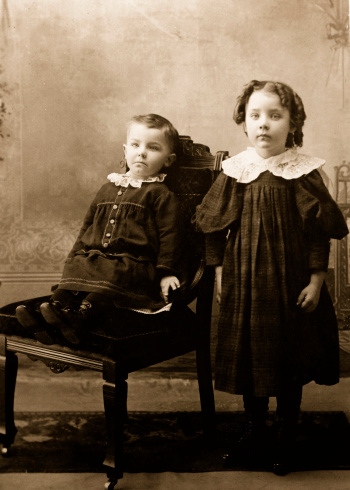 victorian photograph of young girl and baby brother